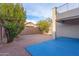 Spacious backyard featuring desert landscaping, covered patio, and small balcony at 7304 E Northridge Cir, Mesa, AZ 85207
