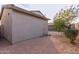 Wide view of the home's backyard with desert landscaping, greenery, and well-maintained exterior at 7304 E Northridge Cir, Mesa, AZ 85207
