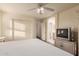 Comfortable bedroom featuring an ensuite bathroom and light-colored walls at 7304 E Northridge Cir, Mesa, AZ 85207