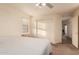 Cozy bedroom with a ceiling fan, neutral carpet, large closet, and comfortable bed at 7304 E Northridge Cir, Mesa, AZ 85207