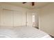 Comfortable bedroom featuring a ensuite bathroom and closet with sliding doors at 7304 E Northridge Cir, Mesa, AZ 85207