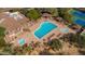 Community pool offers lap lanes, sun loungers, covered seating, hot tub, and mature landscaping at 7304 E Northridge Cir, Mesa, AZ 85207