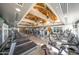 Bright fitness center with treadmills, weight machines, and beautiful ceiling beams at 7304 E Northridge Cir, Mesa, AZ 85207