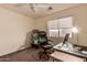 Inviting office space with a desk, comfortable chair, and natural light from the window at 7304 E Northridge Cir, Mesa, AZ 85207
