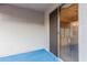 Patio with stucco walls, blue flooring, and sliding glass door entrance at 7304 E Northridge Cir, Mesa, AZ 85207