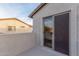 Patio with stucco walls, and sliding glass door entrance at 7304 E Northridge Cir, Mesa, AZ 85207