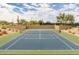 Beautiful view of the well-maintained community tennis court ready for a match on a sunny day at 7304 E Northridge Cir, Mesa, AZ 85207