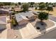 An aerial view showcases the property's tidy yard, driveway, and charming single-story home at 7309 E Diamond Ave, Mesa, AZ 85208