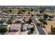 Aerial view of the home in a well-kept community with mature trees and access to a nearby golf course at 7309 E Diamond Ave, Mesa, AZ 85208