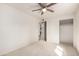 Neutral bedroom featuring a ceiling fan, carpet, and closet at 7309 E Diamond Ave, Mesa, AZ 85208