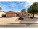 A front exterior view shows this home's tidy yard, desert landscaping, and charming single-story at 7309 E Diamond Ave, Mesa, AZ 85208