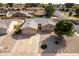 Well-maintained single-story home featuring a two-car garage and a beautifully landscaped front yard at 7309 E Diamond Ave, Mesa, AZ 85208