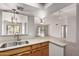 Bright kitchen with stainless steel sink and view of the living room and backyard at 7309 E Diamond Ave, Mesa, AZ 85208