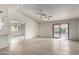 Bright, airy living area featuring tile flooring, natural light, and sliding glass doors at 7309 E Diamond Ave, Mesa, AZ 85208