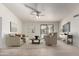 A bright living room with modern furnishings and a sliding door to the backyard patio at 7309 E Diamond Ave, Mesa, AZ 85208