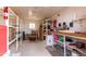 Storage shed interior with shelving and a chair at 7309 E Diamond Ave, Mesa, AZ 85208