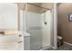Bathroom with a large soaking tub and glass shower with a view of the backyard at 741 W Harvard Ave, Gilbert, AZ 85233