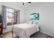 Inviting bedroom with a large arched window, comfortable bed, and stylish decor at 741 W Harvard Ave, Gilbert, AZ 85233