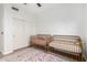 Cozy bedroom with two baby beds and a floral rug with natural light from a window at 741 W Harvard Ave, Gilbert, AZ 85233