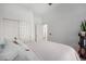 Clean bedroom with ample closet space, white walls, and a neutral-toned bed at 741 W Harvard Ave, Gilbert, AZ 85233