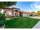 Single-story home featuring desert landscaping, a tile roof, and an arched entryway at 741 W Harvard Ave, Gilbert, AZ 85233