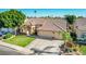 Attractive single-story home with a well-maintained lawn, desert plants, and a spacious driveway leading to the garage at 741 W Harvard Ave, Gilbert, AZ 85233