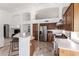 Kitchen boasting stainless steel appliances, breakfast bar, and custom wood cabinets at 741 W Harvard Ave, Gilbert, AZ 85233