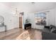 Living room featuring wood flooring, bright natural lighting and neutral color palette at 741 W Harvard Ave, Gilbert, AZ 85233