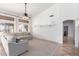 Bright living room featuring a vaulted ceiling, ceiling fan, and natural lighting at 741 W Harvard Ave, Gilbert, AZ 85233