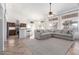 Open concept living area flows into kitchen with large sofa and natural light at 741 W Harvard Ave, Gilbert, AZ 85233