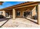 Expansive covered patio with ceiling fans, an outdoor dining set, and a built-in BBQ area at 741 W Harvard Ave, Gilbert, AZ 85233