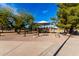 View of the community playground, featuring shade and colorful play equipment at 741 W Harvard Ave, Gilbert, AZ 85233