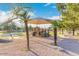 Community playground featuring colorful play structures, a shaded area, and benches for relaxation and Gathering fun at 741 W Harvard Ave, Gilbert, AZ 85233