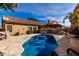 Backyard view of the swimming pool and covered outdoor kitchen, perfect for outdoor entertaining at 741 W Harvard Ave, Gilbert, AZ 85233