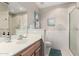 Bright bathroom with a single sink and walk-in shower at 7928 E Pueblo Ave # 56, Mesa, AZ 85208