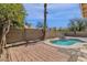 Backyard features mature landscaping, a private pool and a brick patio at 811 N Los Feliz Dr, Chandler, AZ 85226