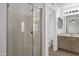 Bright bathroom featuring a glass-enclosed shower and a neutral-toned vanity at 811 N Los Feliz Dr, Chandler, AZ 85226