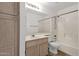 Well-lit bathroom with a vanity and a shower-tub combination at 811 N Los Feliz Dr, Chandler, AZ 85226