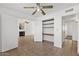 Bedroom with an open door to a large storage closet and neutral tile floors at 811 N Los Feliz Dr, Chandler, AZ 85226