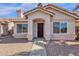 Inviting home featuring a tile roof, desert landscaping, and a welcoming front entrance with a dark wood door at 811 N Los Feliz Dr, Chandler, AZ 85226