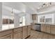 Bright kitchen featuring wooden cabinets, stainless steel appliances, a convenient island and eat-in area at 811 N Los Feliz Dr, Chandler, AZ 85226