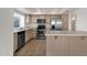 Kitchen with stainless steel appliances, island, and lots of cabinet space at 811 N Los Feliz Dr, Chandler, AZ 85226