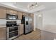Kitchen with stainless steel appliances and overhead lighting at 811 N Los Feliz Dr, Chandler, AZ 85226