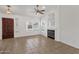 Cozy living room featuring tile floors, a fireplace, and a view of the front door and windows at 811 N Los Feliz Dr, Chandler, AZ 85226