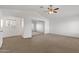 Spacious main bedroom with carpet flooring, ceiling fan and ensuite bathroom at 811 N Los Feliz Dr, Chandler, AZ 85226