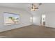 Spacious main bedroom with carpet flooring, ceiling fan and lots of natural light at 811 N Los Feliz Dr, Chandler, AZ 85226