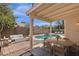 Outdoor patio featuring an in-ground pool, lounge chairs, and a dining set at 811 N Los Feliz Dr, Chandler, AZ 85226