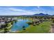 Stunning aerial shot of a lush golf course community with a lake and mountains at 8138 E Via De La Escuela --, Scottsdale, AZ 85258