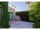 Charming patio space with lush greenery, privacy wall, and sliding glass door access at 8138 E Via De La Escuela --, Scottsdale, AZ 85258