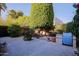 Private backyard area featuring mature trees and a well maintained concrete patio at 8138 E Via De La Escuela --, Scottsdale, AZ 85258